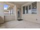 Outdoor patio with neutral stucco, a decorative glass front door, and shuttered windows at 16013 S Desert Foothills Pkwy # 2120, Phoenix, AZ 85048