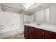 Bathroom featuring a clean white shower and a vanity with dark cabinets at 1645 W Baseline Rd # 2122, Mesa, AZ 85202