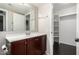 Bathroom with stylish vanity, large mirror, and access to a bright, organized closet at 1645 W Baseline Rd # 2122, Mesa, AZ 85202