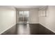 A bedroom with hardwood floors and a sliding glass door leading to the balcony at 1645 W Baseline Rd # 2122, Mesa, AZ 85202