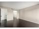 A bright bedroom with hardwood floors and a walk-in closet, perfect for storage at 1645 W Baseline Rd # 2122, Mesa, AZ 85202
