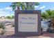 Water Works Condominiums signage featuring lush landscaping, palm trees, and a clear blue sky at 1645 W Baseline Rd # 2122, Mesa, AZ 85202