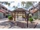 Community gazebo surrounded by mature landscaping, walkable surfaces, and residential buildings at 1645 W Baseline Rd # 2122, Mesa, AZ 85202