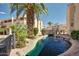 Scenic view of the complex's pond with water fountain, surrounded by lush landscaping and well-maintained buildings at 1645 W Baseline Rd # 2122, Mesa, AZ 85202