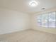 Bright bedroom with wood floors and large window at 18624 E Cattle Dr, Queen Creek, AZ 85142