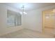 Inviting dining room featuring modern light fixture and large window, creating a pleasant atmosphere at 18624 E Cattle Dr, Queen Creek, AZ 85142