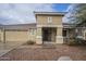 Charming single-story home with a welcoming front porch and well-maintained landscape at 18624 E Cattle Dr, Queen Creek, AZ 85142