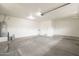 Spacious garage with ample storage, a utility sink, and an automatic door opener at 18624 E Cattle Dr, Queen Creek, AZ 85142