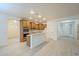 Bright kitchen featuring modern appliances, wooden cabinets and wood flooring at 18624 E Cattle Dr, Queen Creek, AZ 85142