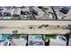 Aerial view of multiple homes and pools with solar panels on rooftops, bordered by a desert landscape at 19061 N Toya St, Maricopa, AZ 85138