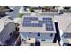 Aerial view showcasing solar panels on the roof of a two-story home in a residential neighborhood at 19061 N Toya St, Maricopa, AZ 85138