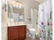 Bathroom with a shower, vanity, and decorative shower curtain at 19061 N Toya St, Maricopa, AZ 85138