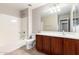 Bathroom with vanity, tile floor, a shower-tub combo, and a neutral color palette at 19061 N Toya St, Maricopa, AZ 85138