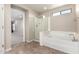 Bathroom featuring a shower and bathtub at 19061 N Toya St, Maricopa, AZ 85138