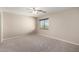 Bedroom with neutral walls and ceiling fan at 19061 N Toya St, Maricopa, AZ 85138