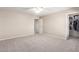 Bedroom featuring neutral walls, plush carpet, and walk-in closet for ample storage at 19061 N Toya St, Maricopa, AZ 85138