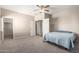 Bright bedroom with neutral carpet and ceiling fan at 19061 N Toya St, Maricopa, AZ 85138