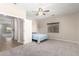 Bright bedroom with neutral carpet and ceiling fan at 19061 N Toya St, Maricopa, AZ 85138