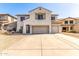 Charming two-story home with a three car garage, desert landscaping, and a neutral color palette at 19061 N Toya St, Maricopa, AZ 85138
