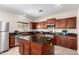 Spacious kitchen featuring a central island and stainless steel appliances at 19061 N Toya St, Maricopa, AZ 85138