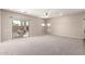 Expansive living room with sliding glass doors for easy access to the backyard at 19061 N Toya St, Maricopa, AZ 85138