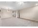 Bright and airy living room with neutral walls, carpeted floors, a ceiling fan and a chandelier at 19061 N Toya St, Maricopa, AZ 85138