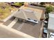 An aerial perspective of the property showcasing the updated exterior and spacious lot with block fence, modern design and covered porch at 1909 N 74Th St, Scottsdale, AZ 85257