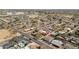 An aerial view shows neighborhood streets, houses, swimming pools, and mature landscaping at 1909 N 74Th St, Scottsdale, AZ 85257