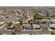 Aerial view showing the property and neighborhood including houses, pools, and mature trees at 1909 N 74Th St, Scottsdale, AZ 85257