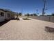 Low maintenance backyard featuring gravel, block wall, artificial turf, and new wood gate at 1909 N 74Th St, Scottsdale, AZ 85257
