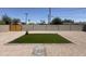 Low maintenance backyard featuring gravel, block wall, artificial turf, and new wood gate at 1909 N 74Th St, Scottsdale, AZ 85257