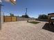 Low maintenance backyard featuring gravel, block wall, artificial turf, and new wood gate at 1909 N 74Th St, Scottsdale, AZ 85257