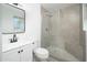 Modern bathroom features a tiled shower and vanity with a framed mirror at 1909 N 74Th St, Scottsdale, AZ 85257