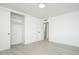 Bright bedroom featuring new gray tile floors, closet and hallway access at 1909 N 74Th St, Scottsdale, AZ 85257