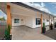 Covered carport features painted brick, wooden support beams, and a landscaped entryway at 1909 N 74Th St, Scottsdale, AZ 85257