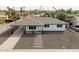 Charming exterior view highlighting the fresh paint, landscaping, covered porch and stepping stone walkway of this beautiful home at 1909 N 74Th St, Scottsdale, AZ 85257