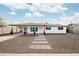 Charming single-story home featuring a covered front porch and a minimalist landscaped yard at 1909 N 74Th St, Scottsdale, AZ 85257