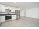 Bright kitchen features stainless steel appliances, white cabinetry, and grey countertops at 1909 N 74Th St, Scottsdale, AZ 85257