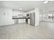 Spacious kitchen featuring white cabinets, stainless steel appliances, and modern gray countertops at 1909 N 74Th St, Scottsdale, AZ 85257