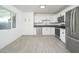 Spacious kitchen with white cabinetry, modern appliances, and bright, natural lighting at 1909 N 74Th St, Scottsdale, AZ 85257