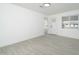 Bright living room featuring new gray tile floors and plenty of natural light at 1909 N 74Th St, Scottsdale, AZ 85257