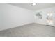 Spacious living room featuring new gray tile floors and plenty of natural light at 1909 N 74Th St, Scottsdale, AZ 85257