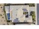 Stunning aerial view of a home with solar panels and a refreshing private pool at 19746 N Heron Ct, Maricopa, AZ 85138