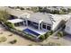 Aerial view of the backyard showcasing a pool, patio, and landscaped surroundings at 19746 N Heron Ct, Maricopa, AZ 85138