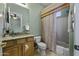 Well-lit bathroom with a shower, vanity, and large mirror at 19746 N Heron Ct, Maricopa, AZ 85138