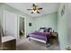 Comfortable bedroom featuring a ceiling fan and neutral wall color at 19746 N Heron Ct, Maricopa, AZ 85138