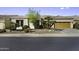 Charming single-story home features a two-car garage and desert landscaping at 19746 N Heron Ct, Maricopa, AZ 85138