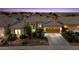 Beautiful single-story home featuring a well-manicured front yard and attached two-car garage at 19746 N Heron Ct, Maricopa, AZ 85138