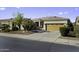 Charming single-story home featuring a two-car garage and desert landscaping at 19746 N Heron Ct, Maricopa, AZ 85138