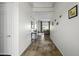 Inviting hallway showcasing tiled flooring and seamless access to the expansive living area at 19746 N Heron Ct, Maricopa, AZ 85138